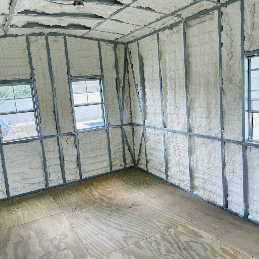 Closed-cell spray foam insulation applied to wall cavities in a residential project in Oelwein